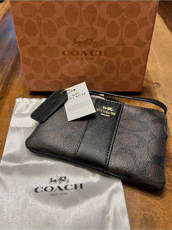 Coach Handbags - Coach Black and Brown Signature Wristlet with Gold Hardware